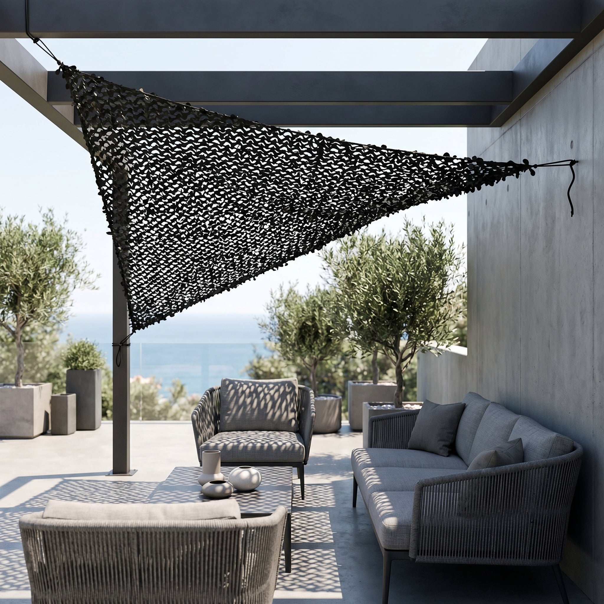 TheFrenchNets jet black triangle shade net installed at a design patio corner.