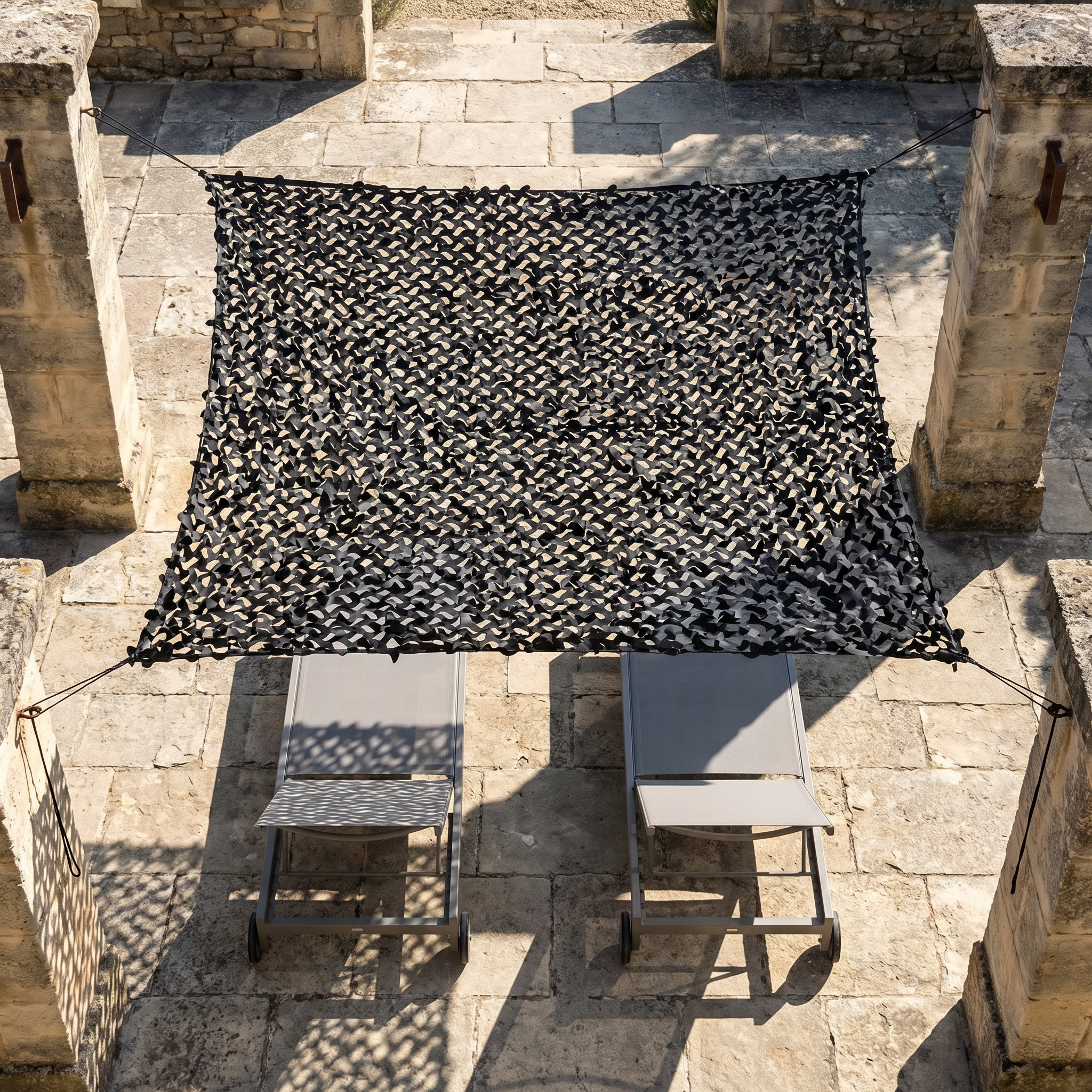 TheFrenchNets jet black shade net above a modern minimal deck.