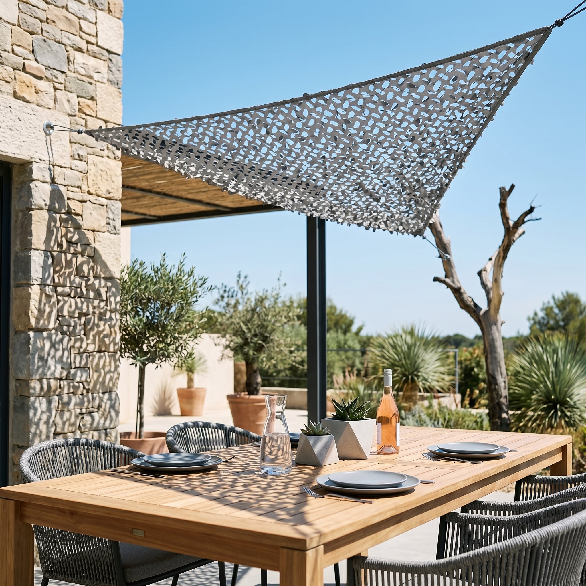 TheFrenchNets graphite triangle shade net installed at a city balcony angle.